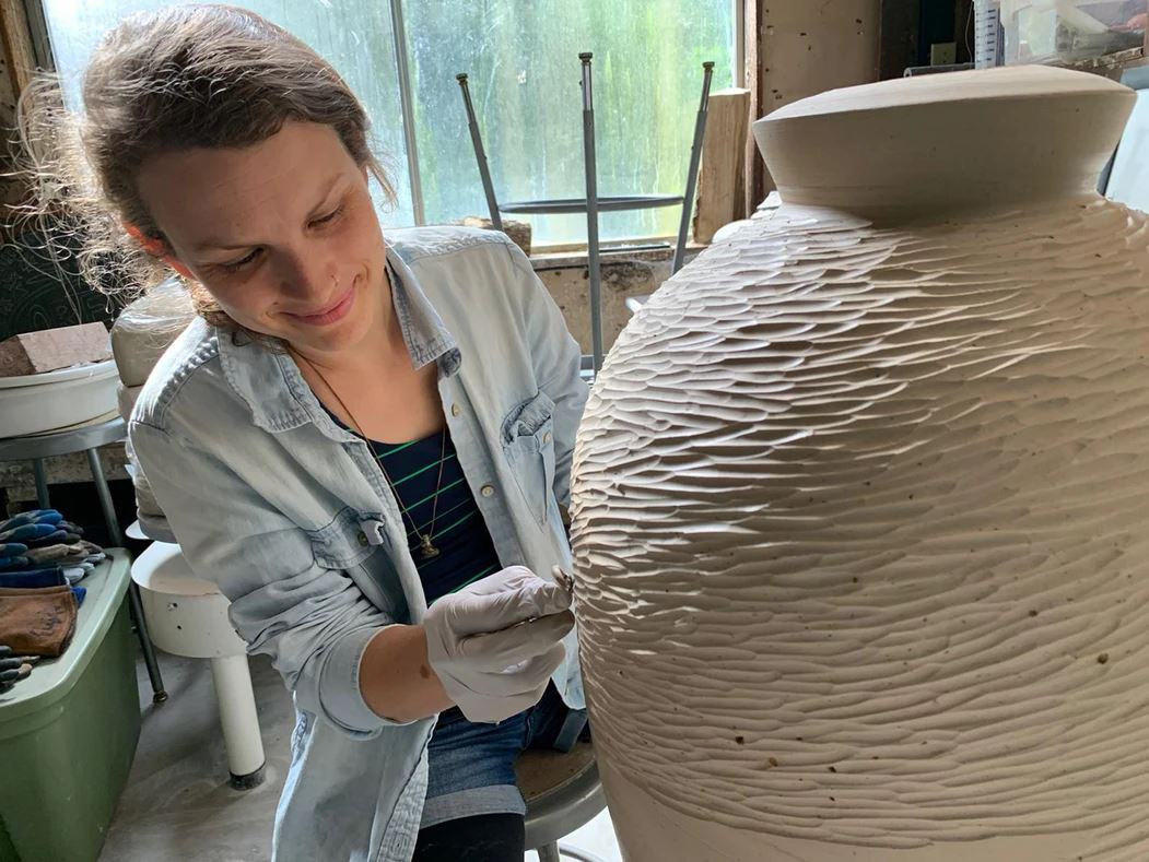 Aubrey Sloan-Carving on pottery