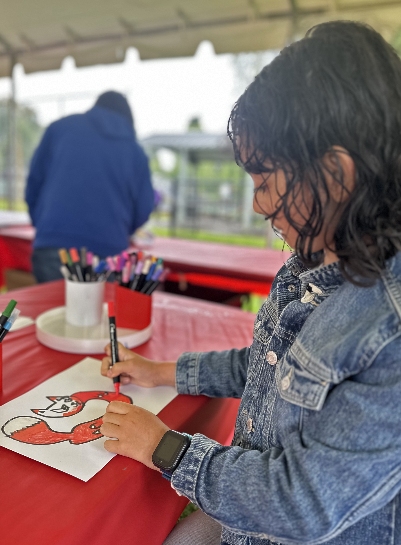 Kids enjoying hands-on activities at the youth tent in George Rogers Park